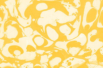 Yellow luxury marble ink texture on watercolor paper background. Marble stone image. Bath bomb effect. Psychedelic biomorphic art.