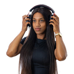 Attractive, young black woman listening to music on with headphones. Wearing a casual black t-shirt. Isolated studio shot with white background.