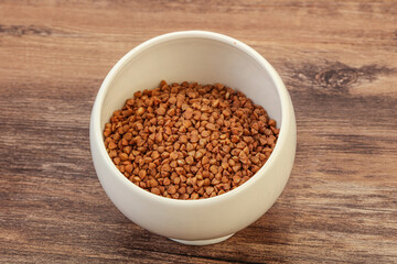 Raw buсkwheat cereal in the bowl
