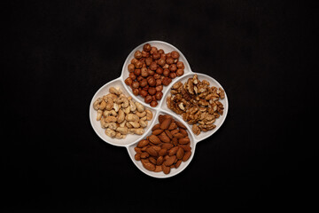 Set of various nuts in white plate