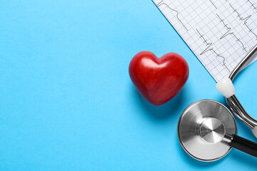 Cardiogram report, red decorative heart and stethoscope on light blue background, flat lay with...