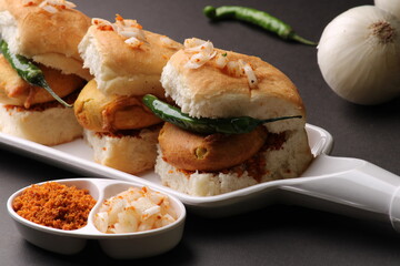 Bombay vada paav is an indian burger. Potato patty is deep fried in gram flour or besan batter and it is served hot with paav or bun like sandwich. Its available and liked all over India