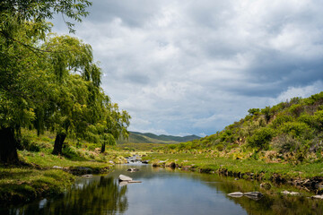 Argentine gravel and dirt routes between countryside landscapes mountains and mountains of Cordoba Argentina in the vicinity of Characato in summer