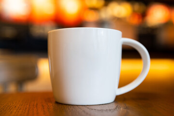 White coffee cup on the table.