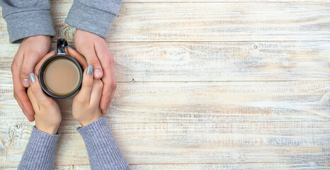 Concept of male and female hands, love and coffee
