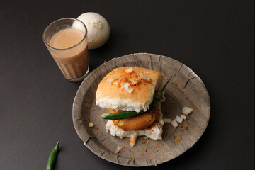 Masala cutting chai and Bombay vada paav is an indian burger. Potato patty is deep fried in gram flour or besan batter it is served hot with paav or bun like sandwich. 