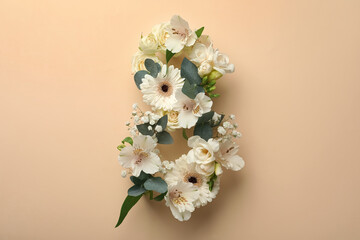 Number 8 made of beautiful white flowers on beige background, flat lay. International Women's day