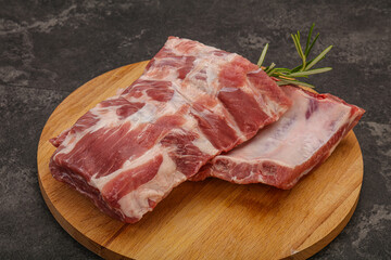 Raw pork ribs served rosemary