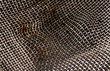 bent mesh of silver wire tea strainer