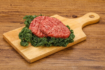 Raw beef burger cutlet for cooking