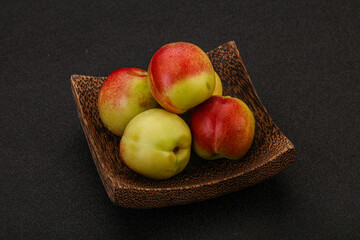 Sweet small nectarines in the basket