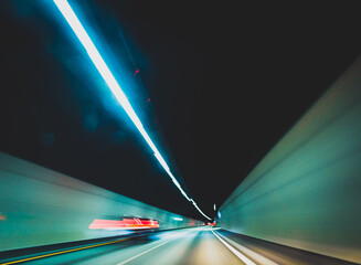 blurred modern underground tunnel in long exposure showing speed