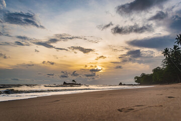 Fototapeta na wymiar Sunset silhouette in Africa's gold coast Axim Ghana West Africa