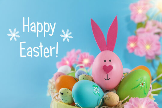 Easter egg bunny on blue backround. DIY decoration. Happy Easter. Craft concept