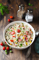 Salad with crab sticks, cabbage and tomatoes