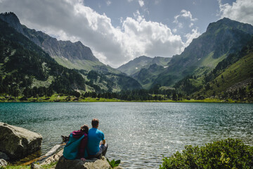 Hikers on the beautiful mountain lake