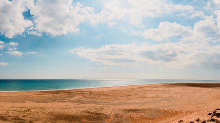 Amazing beach with endless horizon.  Background and Atlantic Ocean. Beach, Fuerteventura, Canary Islands, Spain.