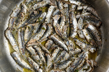 Cooked sardines in pan