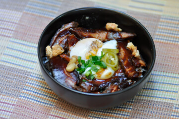 pork ,rice topped with pork and egg