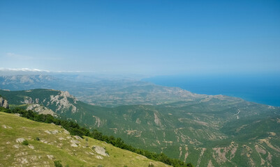 Fototapeta na wymiar View of the Black Sea coast from the valley of the Demerdzhi mountain range in Crimea.
