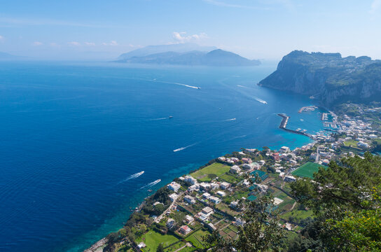 A wonderful panoramic seascape towards the sea from Capri, South Italy. Boats, sky, water and mountains in the background.