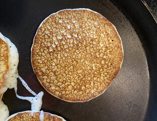 fried pancakes in a frying pan