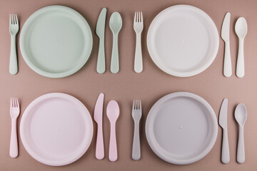 table setting in a restaurant for four persons with a plate spoon fork knife