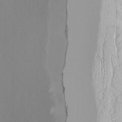  White torn paper collage close-up. Texture made from various paper and cardboard parts. Damaged old paper background. Vintage blank wallpaper. Material design backdrop.