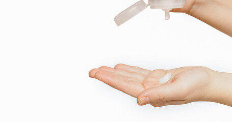 Female caucasian hand squeezes out the cream from the tube into a slightly bent palm into the palm on a white background isolate. health and beauty concept
