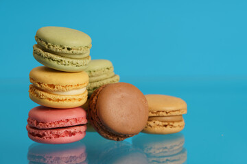 Colorful french macarons on background