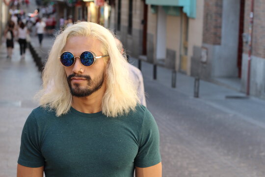 Man with long blonde dyed hair