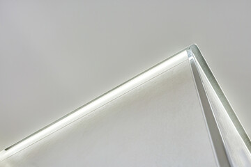 suspended ceiling with halogen spots lamps and drywall construction in empty room in apartment or...