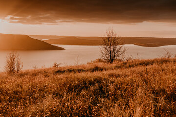 Fototapeta premium panoramic view from the cliff to the big river lake sea in the distance silhouettes of the islands