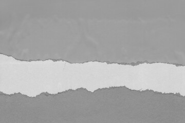 White torn paper collage close-up. Texture made from various paper and cardboard parts. Damaged old paper background. Vintage blank wallpaper. Material design backdrop.