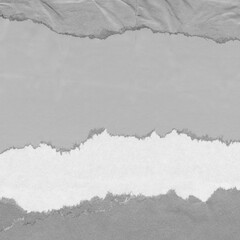 White torn paper collage close-up. Texture made from various paper and cardboard parts. Damaged old...