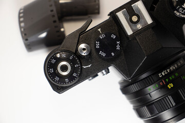 old soviet camera with film on white isolated background