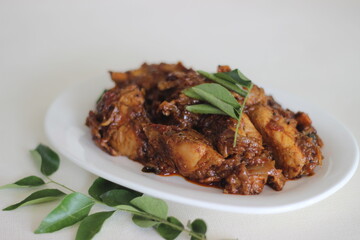 Dry gravy chicken roast prepared in Kerala style
