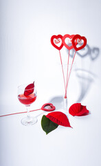 Beautiful arrangement with red wine and sheets and hearts.Love background
