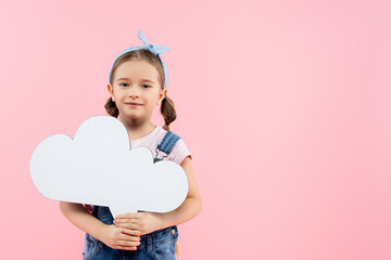 cheerful kid holding thought bubble isolated on pink