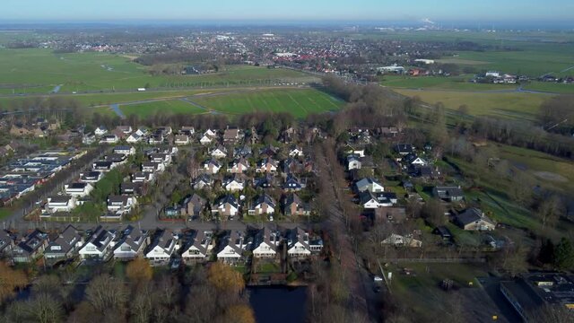 High above Castricum and Limmen with crossroad intersection aerial 4k