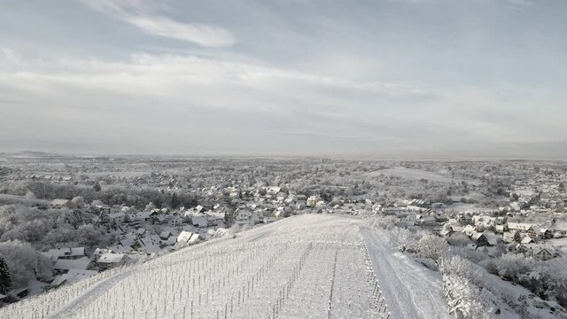 Tranquil Residential Area At Offenburg Near Vineyards Of Ortenberg In Zell-Weierbach, Germany During Winter. - Aerial Pullback Shot