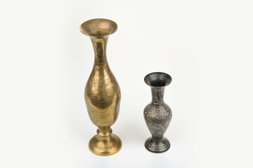 Gold metal carving vase on a white
