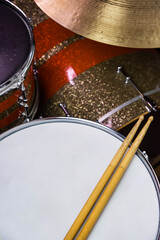 Closeup of drumsticks lying on the professional drum set. Drummer equipment. 