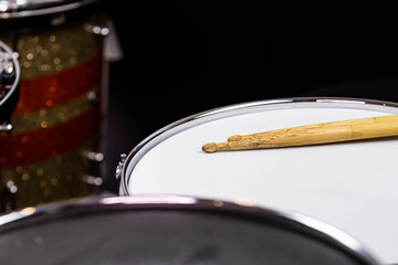 Closeup of drumsticks lying on the professional drum set. Drummer equipment. 