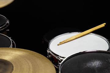 Closeup of drumsticks lying on the professional drum set. Drummer equipment. 