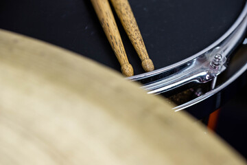 Closeup of drumsticks lying on the professional drum set. Drummer equipment. 