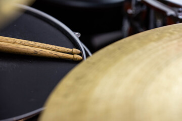 Obraz premium Closeup of drumsticks lying on the professional drum set. Drummer equipment. 