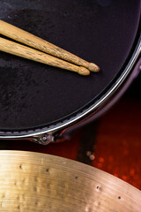 Closeup of drumsticks lying on the professional drum set. Drummer equipment. 