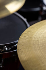 Closeup of drumsticks lying on the professional drum set. Drummer equipment. 
