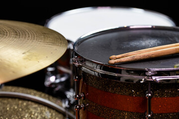 Closeup of drumsticks lying on the professional drum set. Drummer equipment. 